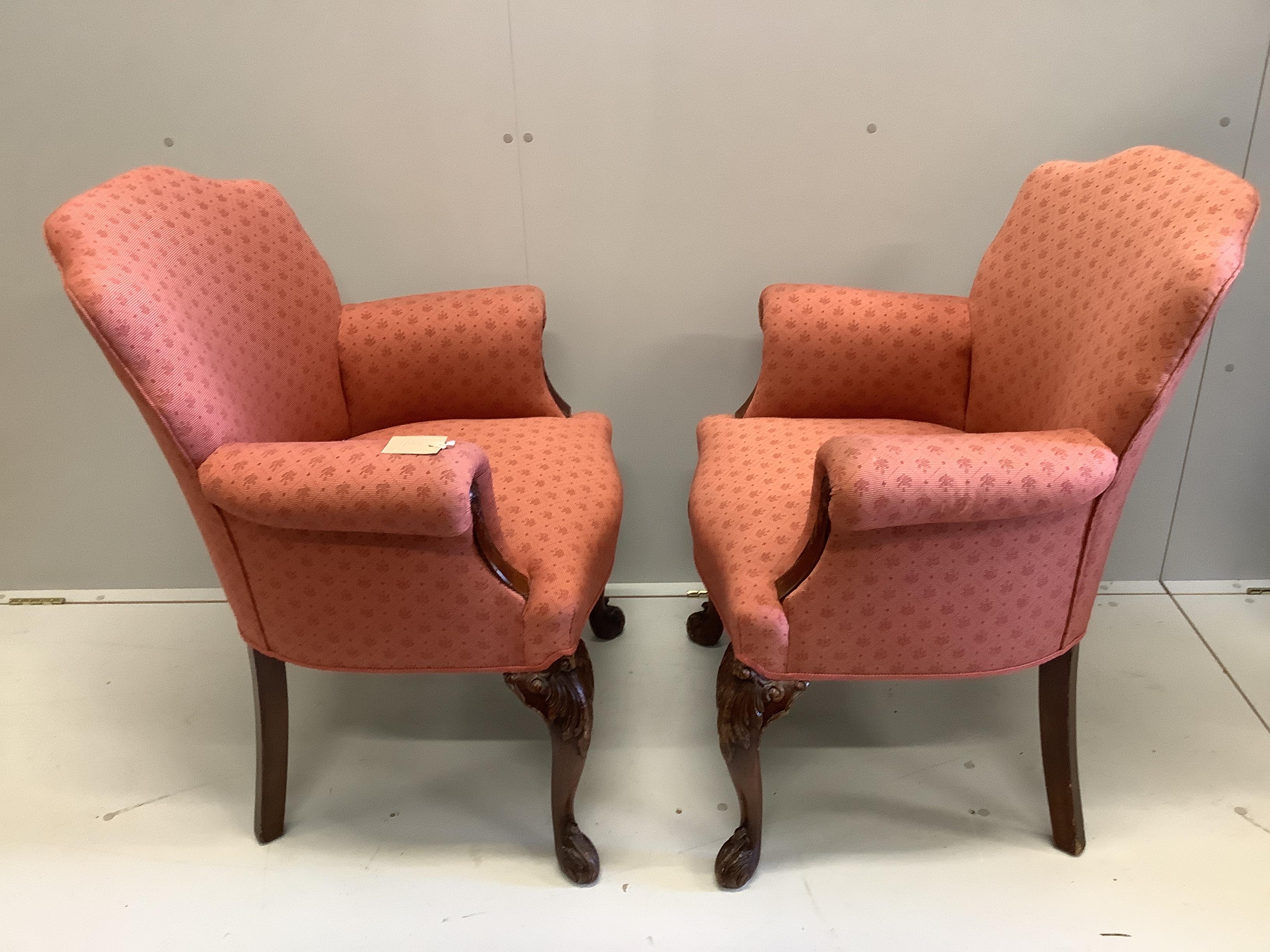 A pair of George II style upholstered scroll armchairs, width 72cm, depth 60cm, height 91cm